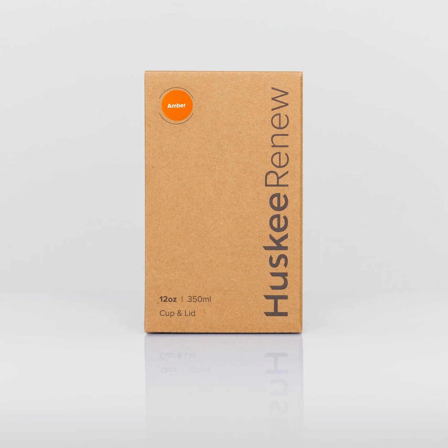 Image of the cup and lid box on a white background. The box is kraft brown with huskee branding printed on the side.